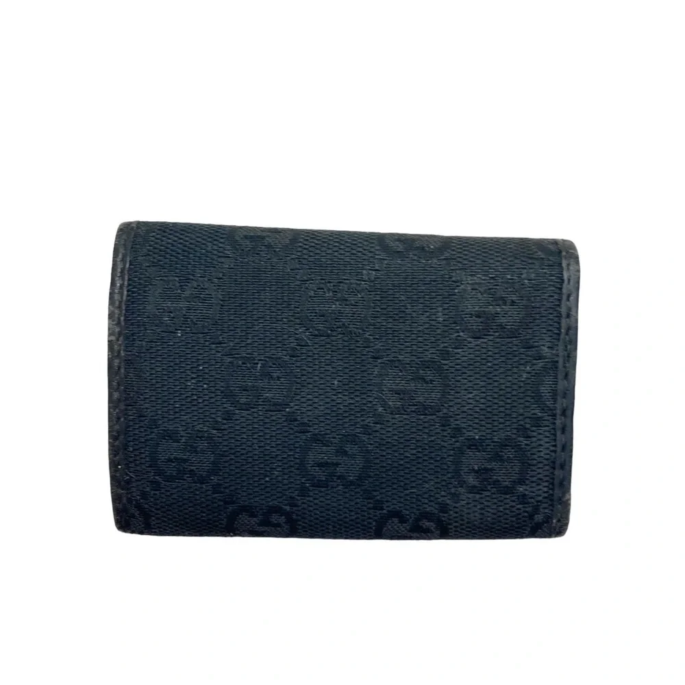 Gucci black signature canvas leather key holder